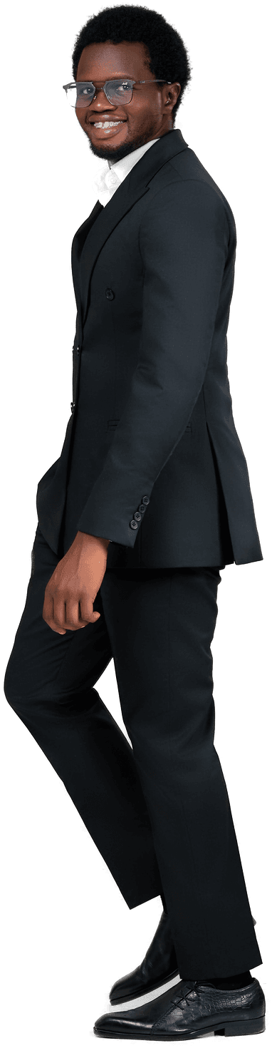 Victor Daniyan standing in a tailored black suit